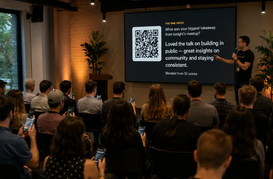 A meetup crowd answering on their phones while the host points at a screen showing the question, a QR code, and the one voice blended from 32 voices