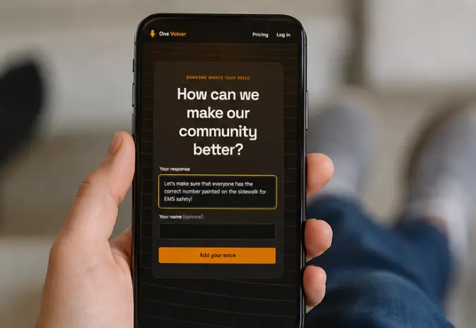 A hand holding a phone showing the question “How can we make our community better?” with a typed answer about painting correct house numbers on the sidewalk for EMS safety, and an optional name field.
